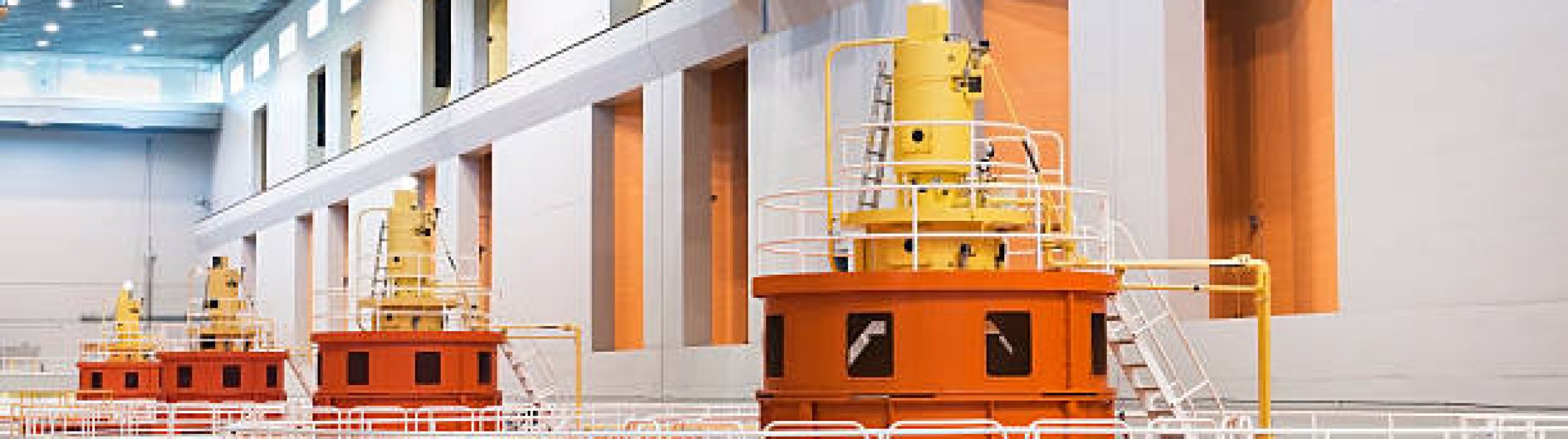 "Row of the tops of hydropower generators working at a dam.   The huge turbines in these generators turn as the water blasts through, creating electricity.Click below for more in this series plus of all of my fuel and energy shots:"